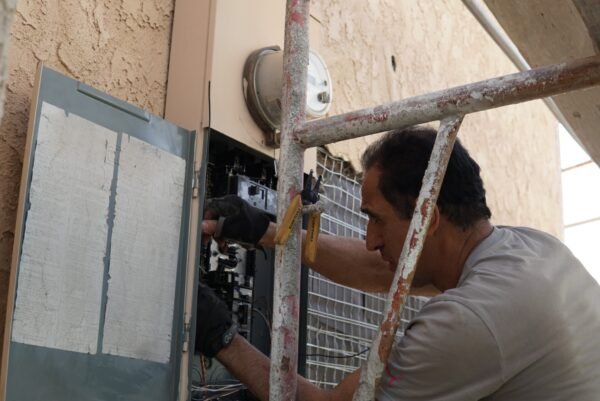 Electrician installing and upgrading an electrical panel in Los Angeles, CA.