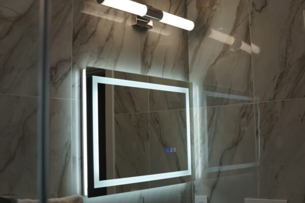 Modern bathroom vanity mirror with lighting installed by LAProElectrical.
