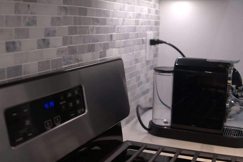 Professionally installed GFCI outlets in a kitchen by LA Pro Electrical, ensuring safe and code-compliant power for appliances like refrigerators and coffee machines.