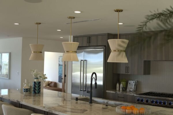A modern kitchen with beautifully installed recessed and pendant lighting by LA Pro Electrical.