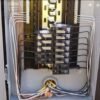 Residential electrical panel installation with upgraded wiring and circuit breakers.