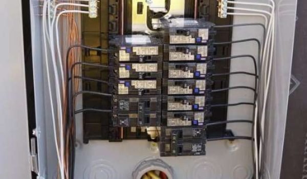 Residential electrical panel installation with upgraded wiring and circuit breakers.